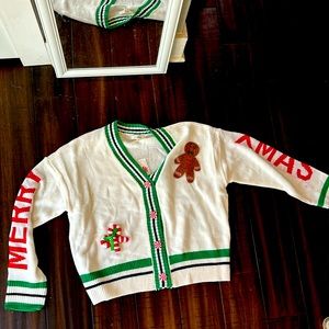 A gingerbread man ugly Christmas sweater